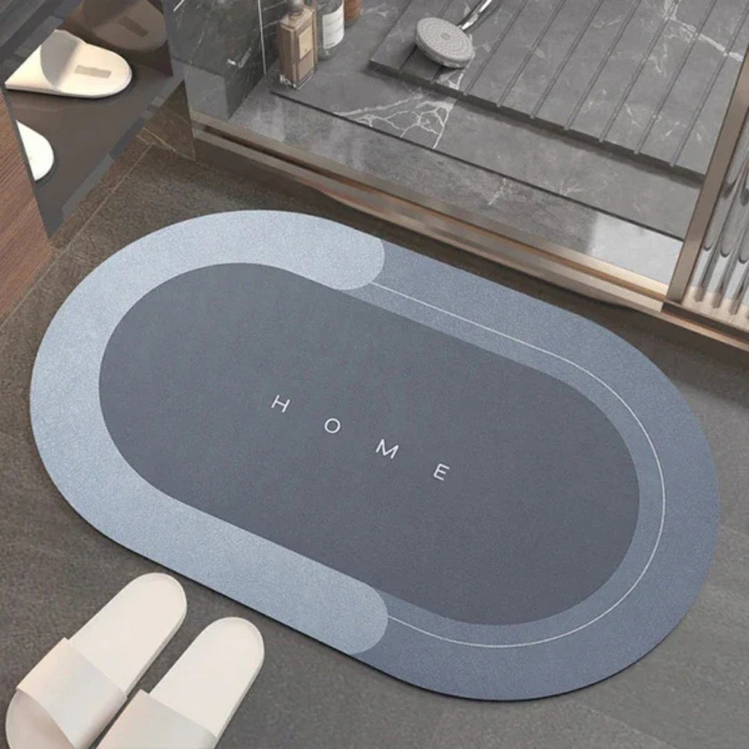 Blauwgrijze ovale badmat bij een douche