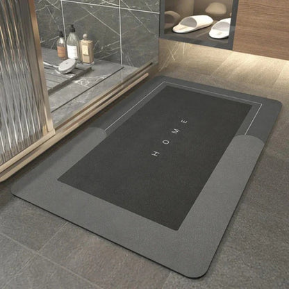 Donkergrijze rechthoekige badmat bij een douche