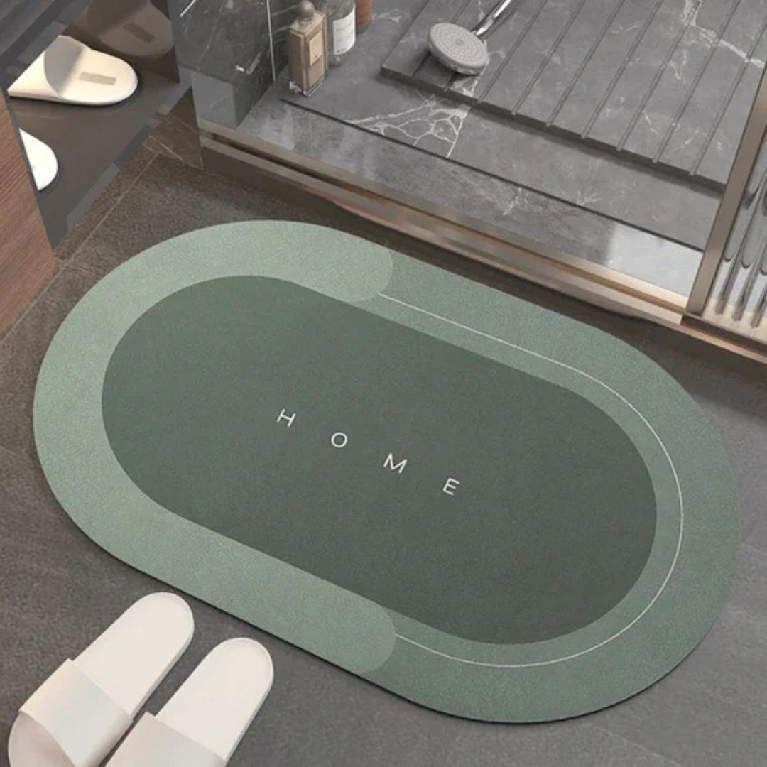 Groene ovale badmat bij een douche