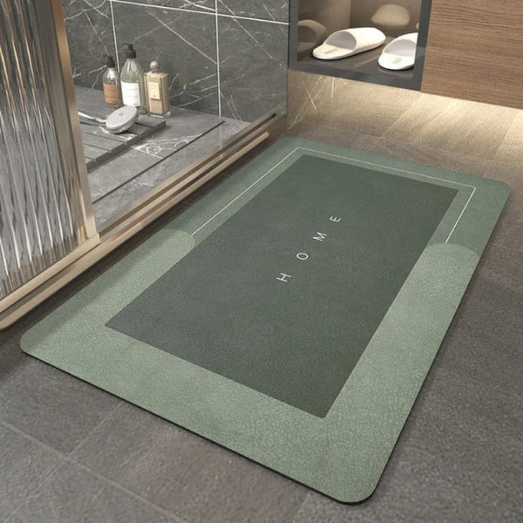 Groene rechthoekige badmat bij een douche