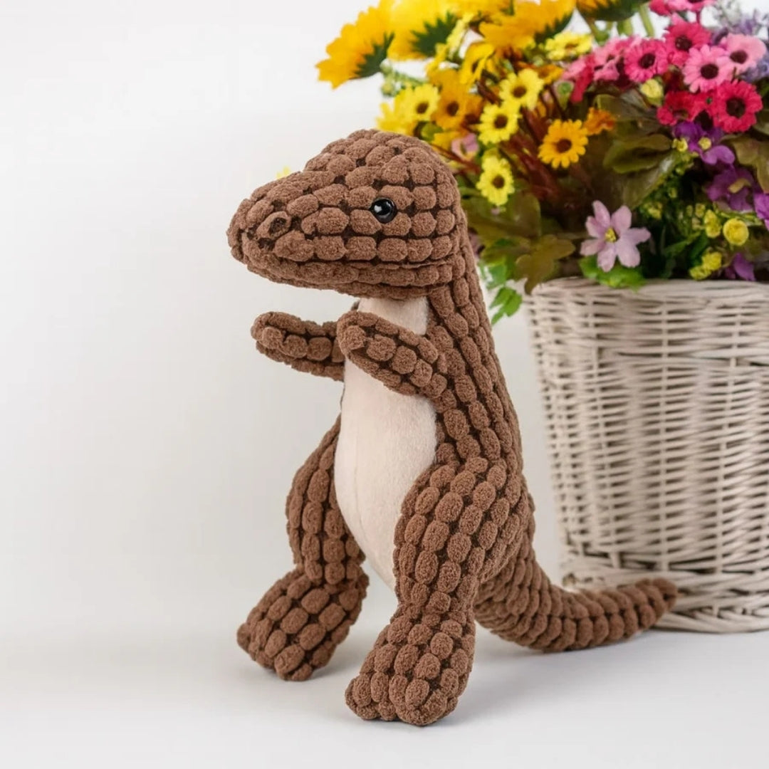 Bruine pluche dinosaurus met lichte buik