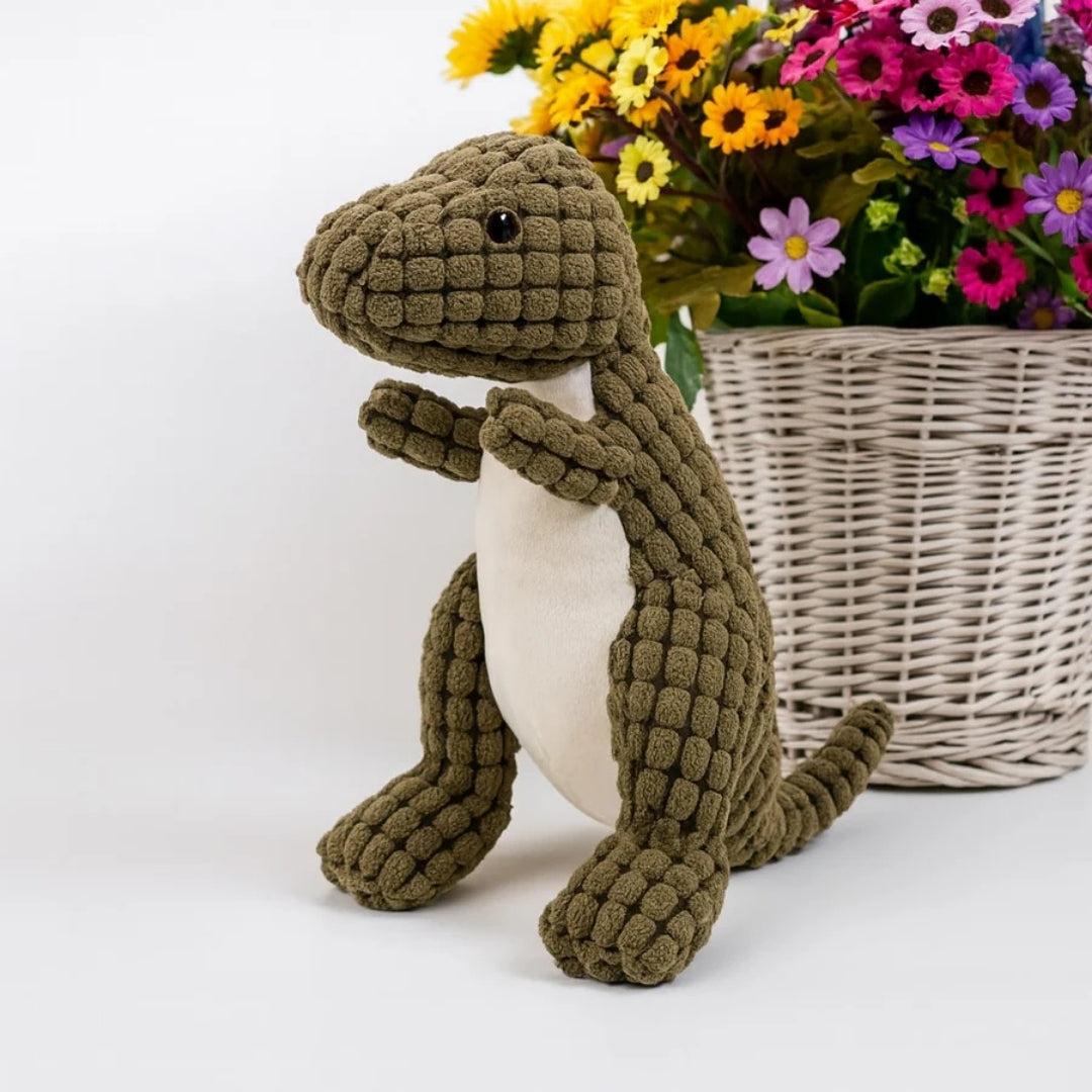 Groene pluche dinosaurus met lichte buik