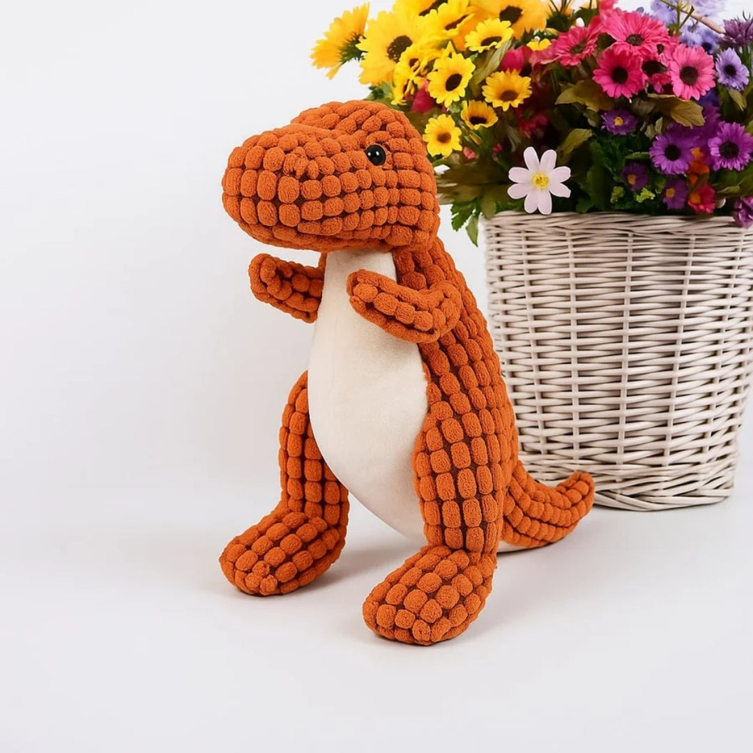 Oranje pluche dinosaurus met lichte buik