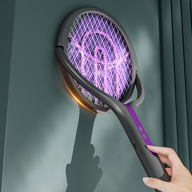 Hand houdt een elektrische vliegenmepper met paarse verlichting