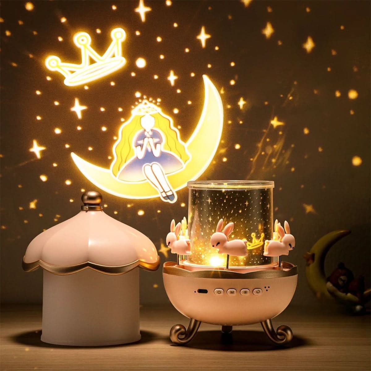 Roze Luminova sterrenprojector met de kap ernaast en een prinsessenprojectie