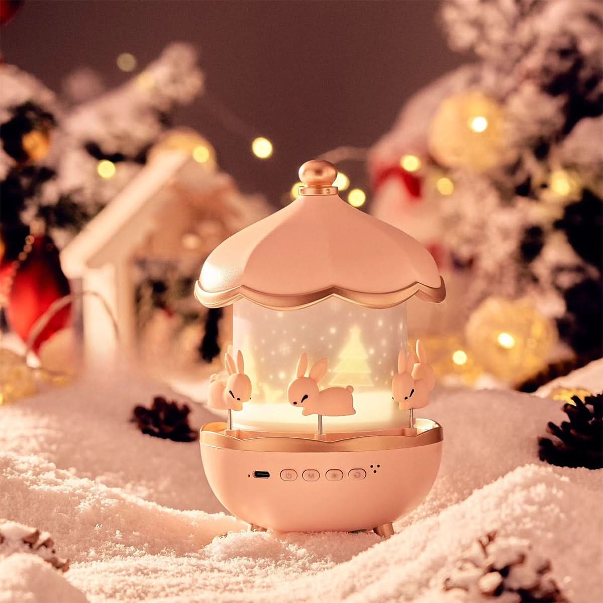 Verlichte roze Luminova sterrenprojector tussen winterdecoraties